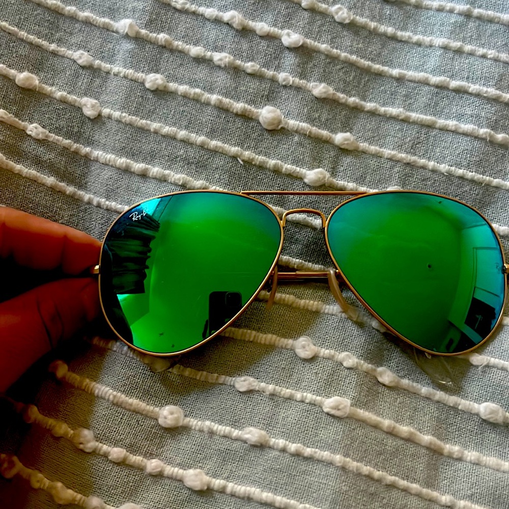 Never used green Ray Ban reflective lens .